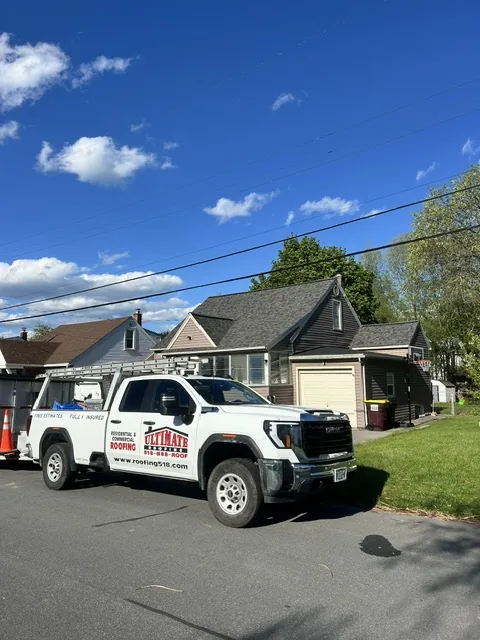Capital Region NY — charcoal-gray shingle roof replacement on a Cape Cod home — Ultimate Roofing