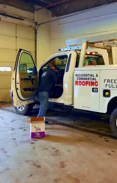 Ultimate Roofing crew loading a residential & commercial roofing service truck — Capital Region NY