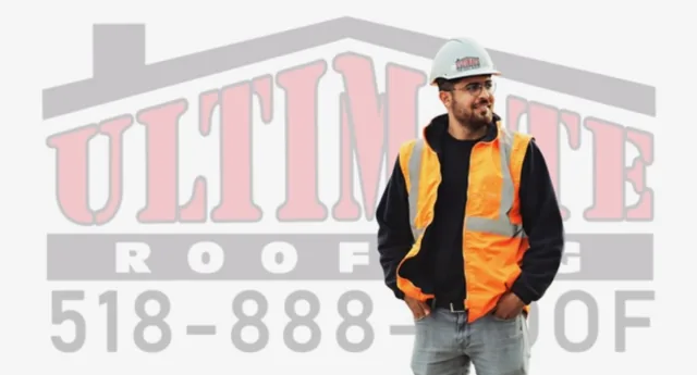 Ultimate Roofing crew member in safety vest and hard hat — Capital Region NY roofing company